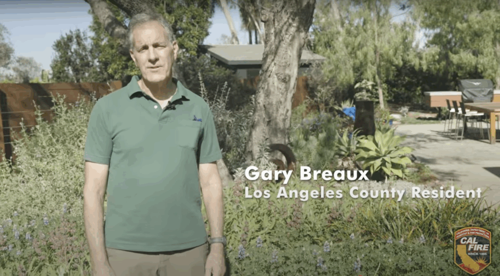 This is an image of Gary Breaux in his garden which is a showcase for defensible space.